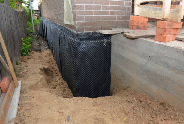 SJ Waterproofing Pros technician performing targeted Emergency Waterproofing assessment in Harpersville, AL